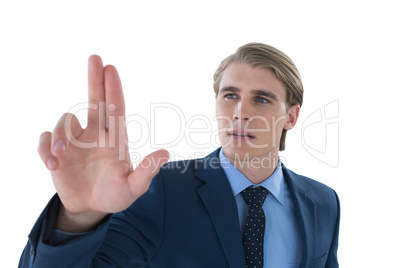 Young businessman touching invisible imaginary interface