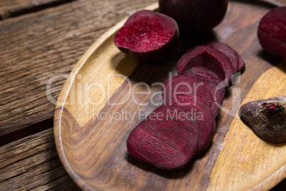 Slice of beetroots in wooden tray
