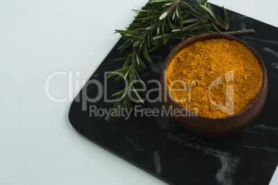 Rosemary with turmeric powder in bowl
