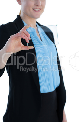 Mid section of smiling businesswoman wearing suit showing glass interface