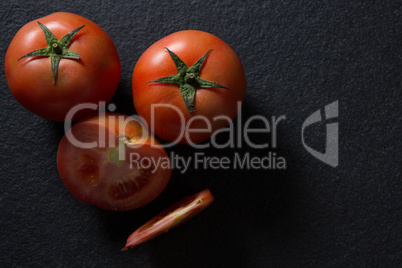 Tomatoes on black background