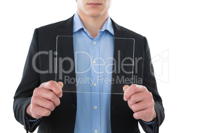 Mid section of businessman showing transparent glass interface