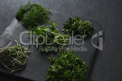 Various herbs on chopping board