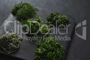 Various herbs on chopping board