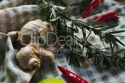 Ginger and rosemary on table cloth