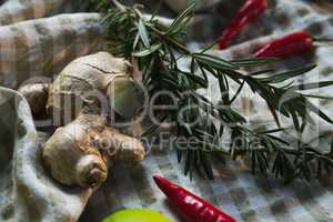 Ginger and rosemary on table cloth