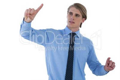 Young businessman working on imaginary screen