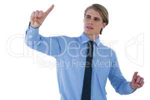 Young businessman working on imaginary screen