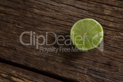 Halved lemon on wooden table