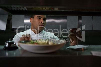 Chef looking at an order list in the commercial kitchen