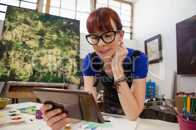 Beautiful woman using digital tablet