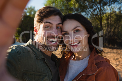 Portrait of happy couple on field