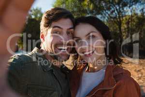 Portrait of happy couple on field