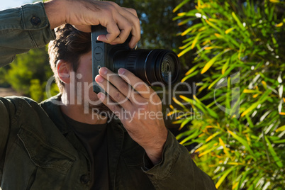Close-up of young man photographing