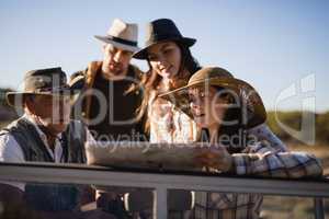 Friends looking at map in vehicle