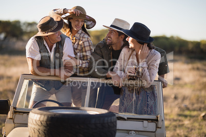 Happy friends enjoying during safari vacation