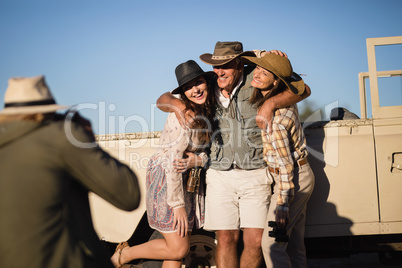 Man taking a picture of his friends during safari vacation
