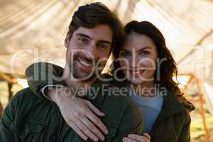 Portrait of smiling couple in tent