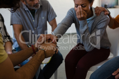 Friends consoling woman