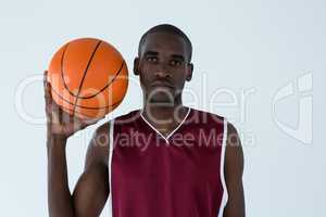 Confident player holding basketball