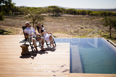 Couple relaxing while having a glass of drink