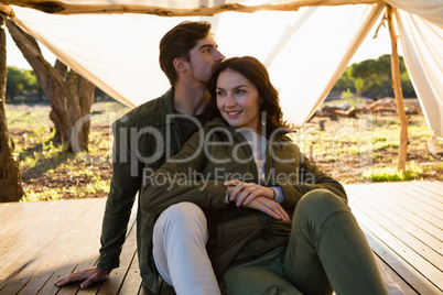 Young couple relaxing in tent