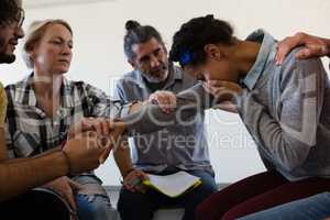 Friends consoling sad woman