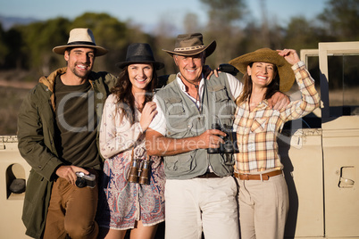Portrait of happy friends enjoying during safari vacation