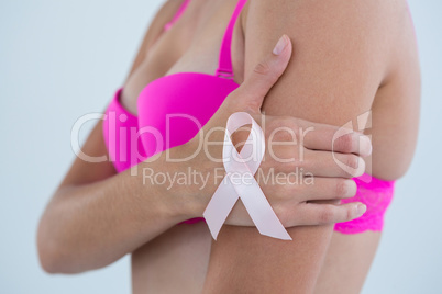 Side view of woman Breast Cancer Awareness ribbon