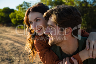 Happy couple looking away