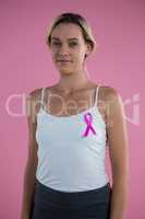 Portrait of smiling with Breast Cancer Awareness ribbon
