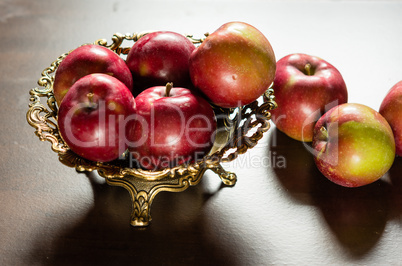 Red Apples in a bronze vase