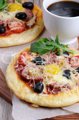 Mini pizza with a cup of coffee