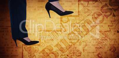 Composite image of conceptual image of businesswoman in heels climbing steps