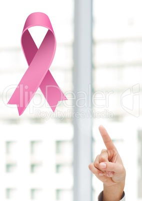 Pointing hand with pink ribbon for breast cancer awareness