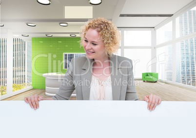 Business woman holding blank card in office