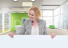 Business woman holding blank card in office