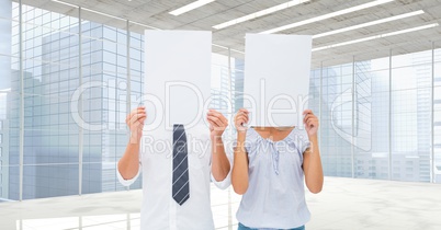 Business people holding blank card in office