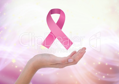 Open hand with pink ribbon for breast cancer awareness