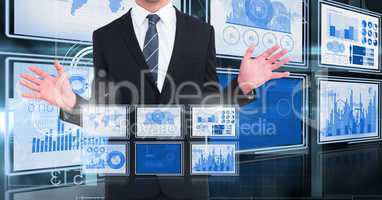 Businessman touching and interacting with technology interface panels