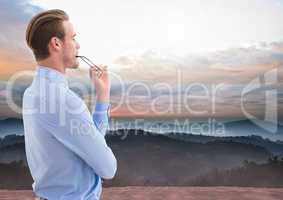 Businessman in nature mountains