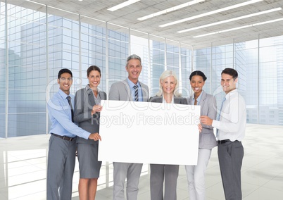 Business people holding blank card in office