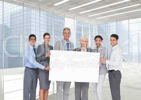 Business people holding blank card in office