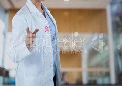 Doctor woman with breast cancer awareness ribbon