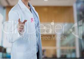 Doctor woman with breast cancer awareness ribbon