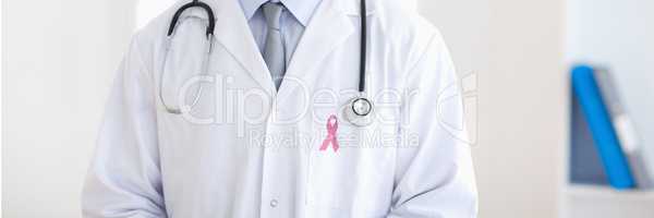 Doctor man with breast cancer awareness ribbon