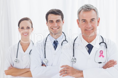 Doctors with breast cancer awareness ribbon