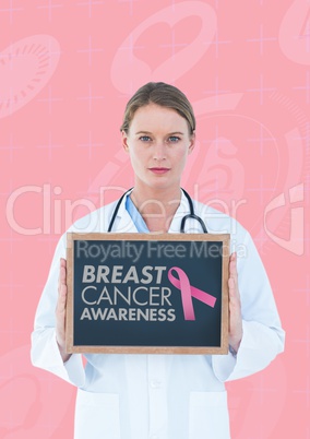 Doctor holding a blackboard with a breast cancer awareness ribbon