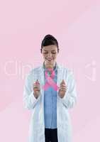 Doctor woman with breast cancer awareness ribbon