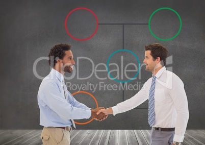 Businessmen shaking hands with mind map